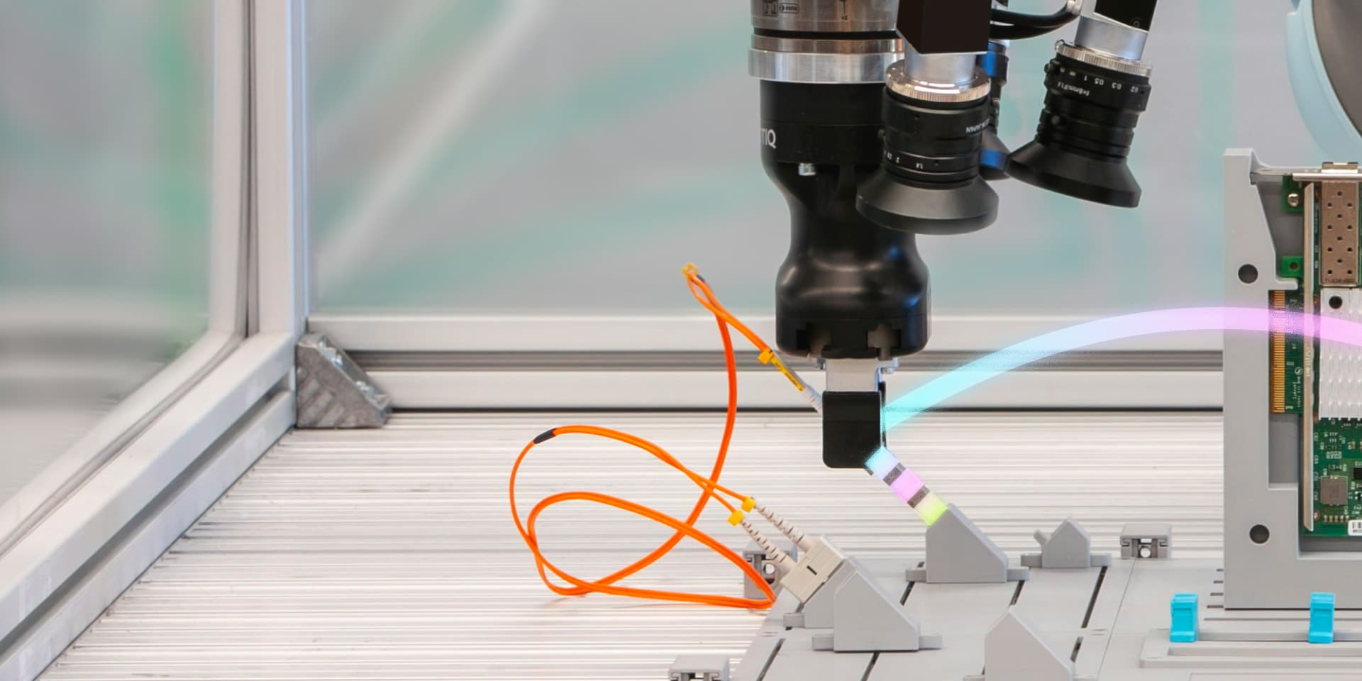 Robot inserting a fiber-optic connector at the Intrinsic challenge rig
